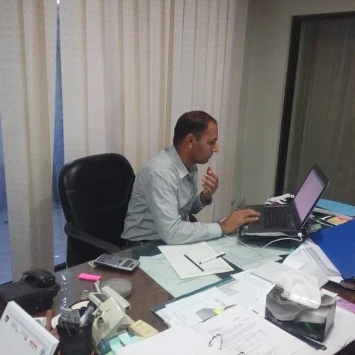 Local SEO expert working on a laptop in an office, analyzing client results and optimizing search visibility for improved rankings.